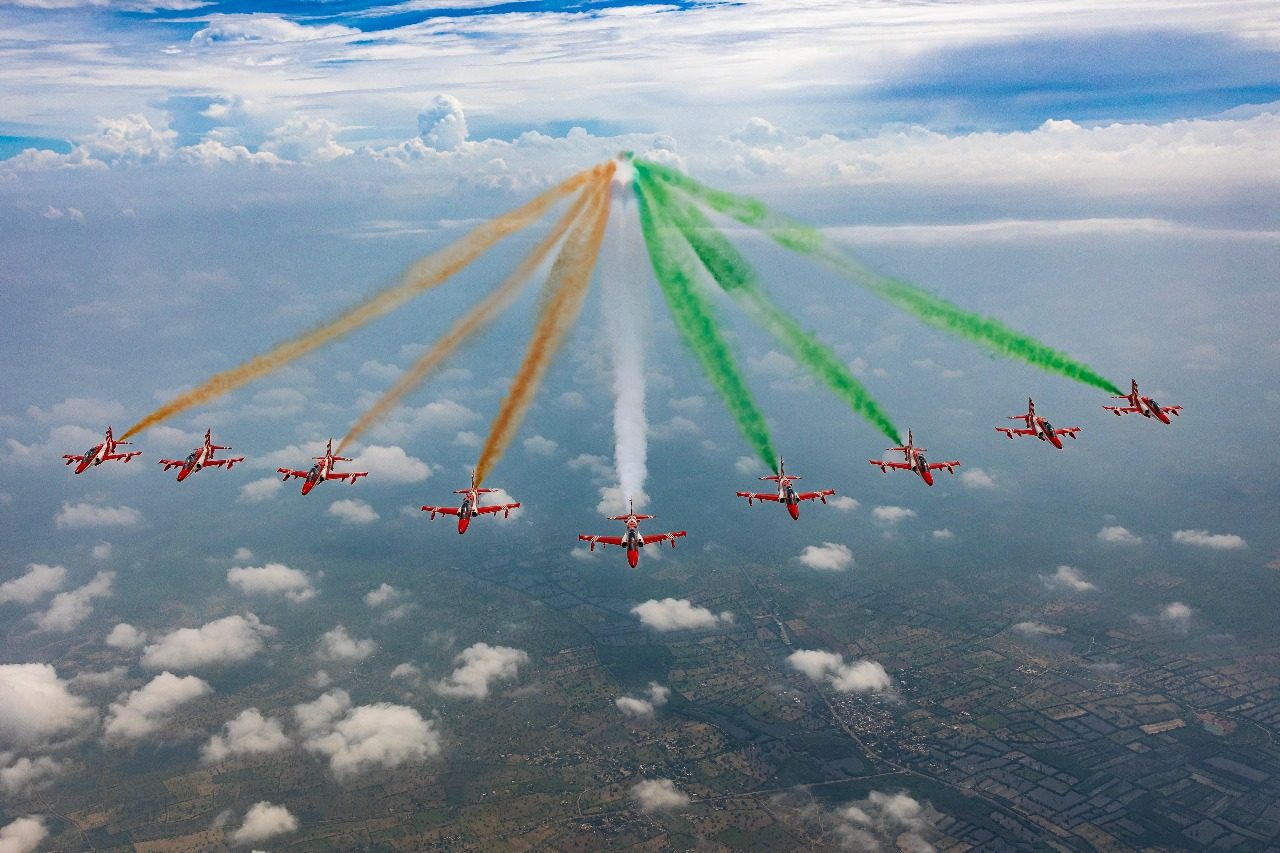 The nine Hawks in formation over the countryside