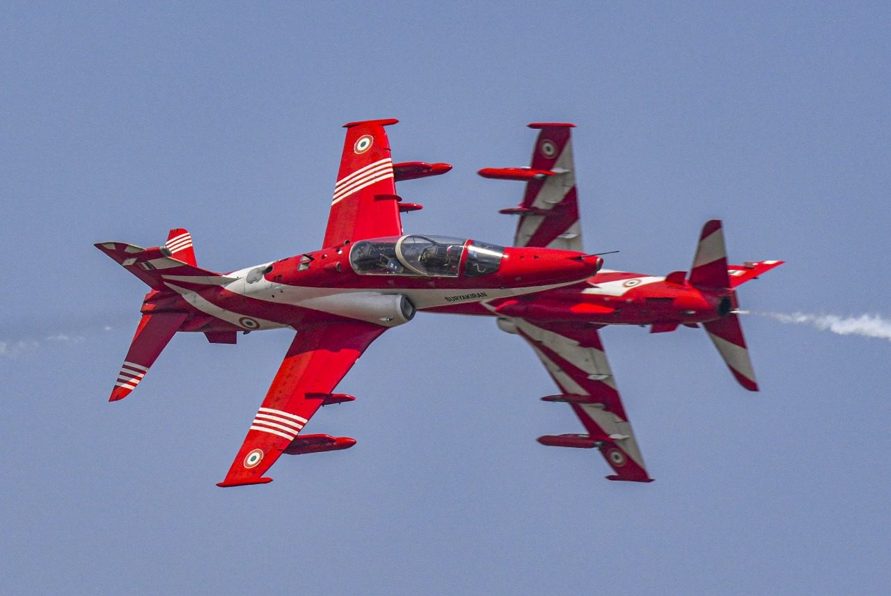 Two Hawks crossing in a close pass